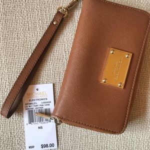 Authentic Michael Kors saffiano wristlet wallet.